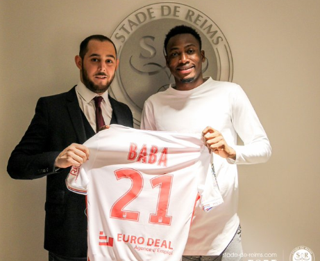 Razak Braimah congratulates Baba Rahman on his Stade Reims move
