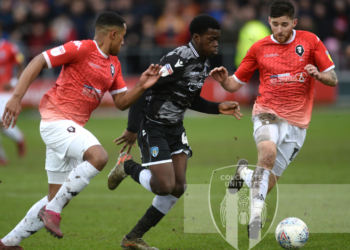 Kwame Poku scores for Colchester United in English League Two win over Thomas Asante’s Salford City