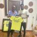 Partey presents jersey to Gabby Otchere Darko