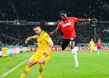 Ghanaian defender Derrick Kohn reacts to Hannover 96 defeat to Dortmund in DFB-Pokal