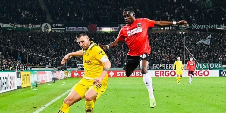 Ghanaian defender Derrick Kohn reacts to Hannover 96 defeat to Dortmund in DFB-Pokal