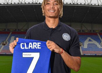 Wigan Athletic sign English-born Ghanaian defender Sean Clare on a three-year deal