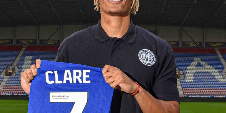 Wigan Athletic sign English-born Ghanaian defender Sean Clare on a three-year deal