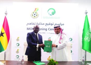 Saudi Arabian Football Federation president Yasser Almisehal congratulates re-elected GFA president Simeon-Okraku