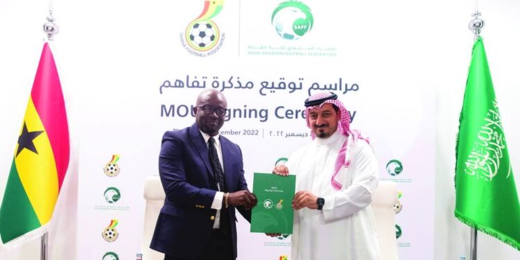 Saudi Arabian Football Federation president Yasser Almisehal congratulates re-elected GFA president Simeon-Okraku