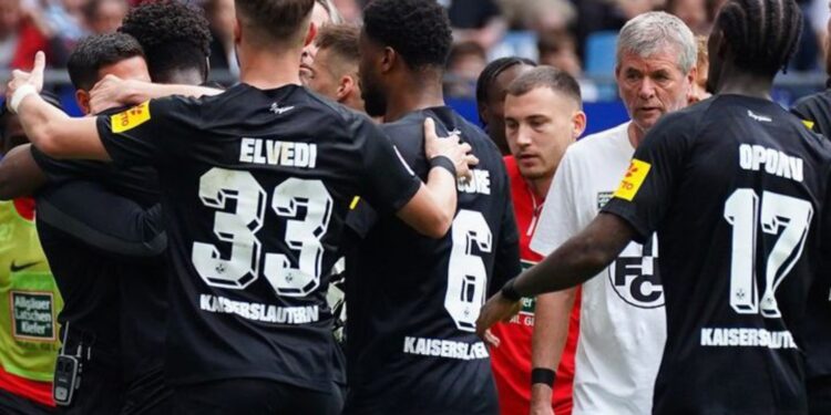 Ghanaian forward Ragnar Ache scores for Kaiserslautern at Hamburg