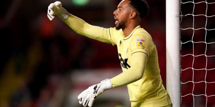Black Stars goalkeeper Jojo Wollacott marks Crawley Town in win over Blackpool